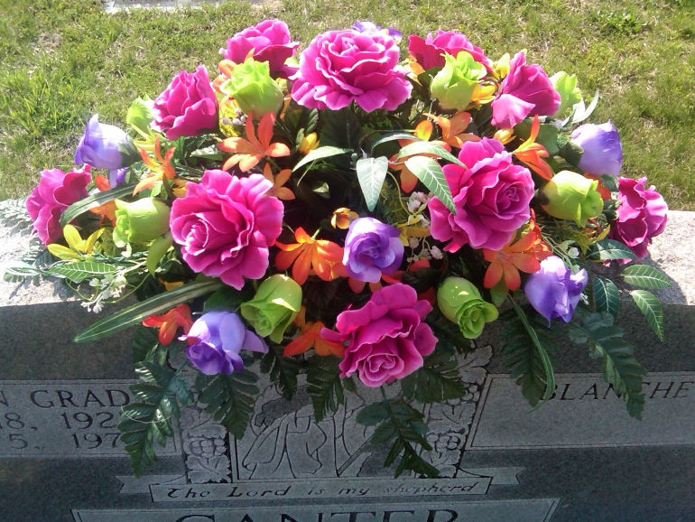 Twigs and flowers on the grave